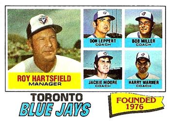 1977 Topps #113 Toronto Blue Jays / Roy Hartsfield / Don Leppert / Bob Miller / Jackie Moore / Harry Warner Front