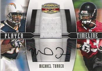 2008 Donruss Gridiron Gear - Player Timeline Jerseys Autographs #PT-20 Michael Turner Front