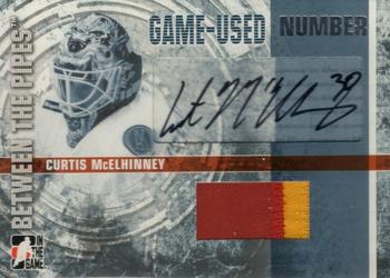 2006-07 In The Game Between The Pipes - Game Used Number Autograph #GUN-CM Curtis McElhinney  Front