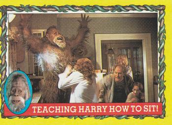1987 Topps Harry and the Hendersons #19 Teaching Harry How To Sit! Front