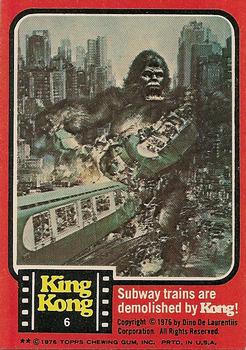 1976 Topps King Kong #6 Subway trains are demolished by Kong! Front