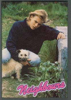 1988 Topps Neighbours Series 2 #33 Scott Robinson (Jason Donovan) and Lucy's pet terr Front