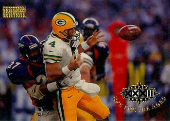 1998 SkyBox Premium #197 Atwater blindsides Favre, causing fumble Front