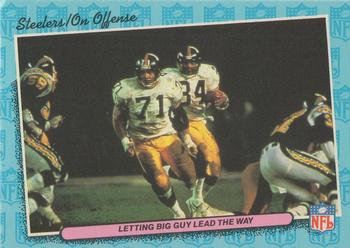1986 Fleer Team Action #64 Letting Big Guy Lead the Way Front