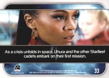 2009 Rittenhouse Star Trek Movie Cards #33 As a crisis unfolds in space, Uhura and the ot Back